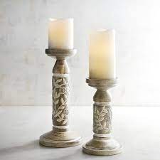 Thick, black iron rods curl and bend to create three beautiful pedestals for the lucky pillar candles of your choice. Pin On Decor To Buy