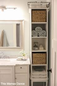 For a simple fix, enlist shelf risers, typically used in kitchen cabinets for dishes and cups. 11 Incredible Bathroom Decorating Ideas Bathroom Towel Storage Cottage Cabinet Diy Bathroom Storage