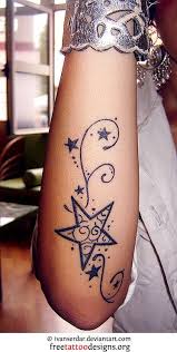 What are some cute tattoos for girls? Curly Stars Design On A Girls Arm Tattoos Star Tattoo Designs Star Tattoos