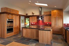 Custom Cherry Cabinetry Bright Red Tile And A Slate Tile Floor Complement One Another In This Striki Slate Kitchen Slate Floor Kitchen Maple Kitchen Cabinets