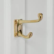 The coat rack must be within reasonable reach without requiring a footstool, and it also must be high enough to keep coats from touching the ground. Brass Coat Hook Double Coat Hook Traditional Coat Hooks