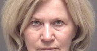 Woman, 68, charged in cyclist's death