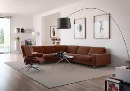 The graceful tufting covers the back and arms creating a modern interpretation of a classic design. 5 Tips For Decorating With Brown Leather Furniture Blog