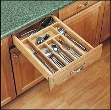 Make your own rotating utensil caddy with a wooden circle, a lazy susan and some stylish stainless steel cups. 14 Ways To Organize The Kitchen Silverware Drawer Core77