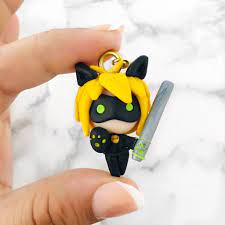 Cat Noir Keychain Miraculous Ladybug In 2021 Pink Heart Logo Miraculous Ladybug Cat Polymer Clay