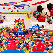 This red and white striped one covered in bright paper medallions with disney characters does just that and is a fantastic idea for us to start off with! Mickey Mouse Birthday Party Ideas Party City