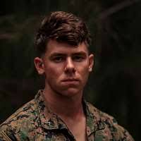 U.S. Navy Gunner's Mate 2nd class Thomas Clary, background,