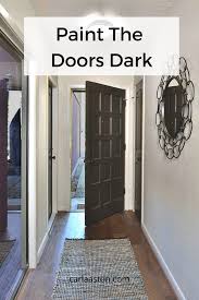 Bespoke folding screens flank a. Paint Or Stain Your Doors Dark To Add Some Dramatic Punctuation In Your Home Designed