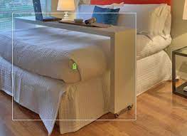 over queen bed rolling table guest counter example only these are custom diy copies of a smaller ikea table has casters can roll bed table bed bed desk