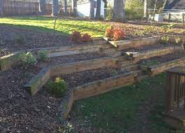 You can do different things with timbers that easy and just on a budget. Landscape Design Sloped Backyard Landscaping Sloped Backyard Landscaping Retaining Walls