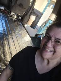 Estrella's first experience with snow and a leaf pile