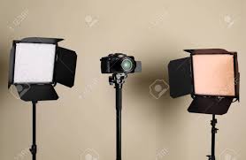 Professional Video Camera And Lighting Equipment On Beige Background Stock Photo Picture And Royalty Free Image Image 137589015