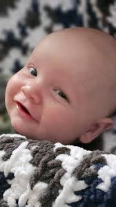 I finished the baby blanket I was crocheting that I posted about yesterday  for my son. He is in love with it and has not let me take it away from him