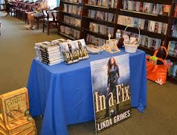 A book signing is an event, usually at a bookstore or library where an author sits and signs books for a period of time. Book Signing Table Need Something To Wow Them Book Signing Party Book Release Party Book Signing Event