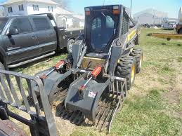 From inside the cab, you can lock and unlock the . 2005 New Holland L180 Skid Steer Bigiron Auctions