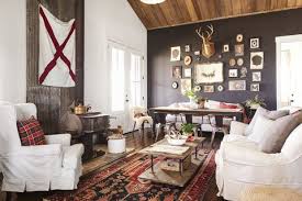 The couch closely resembles a daybed, covered in plus white and gray blankets and pillows. 25 Rustic Living Room Ideas Modern Rustic Living Room Decor And Furniture