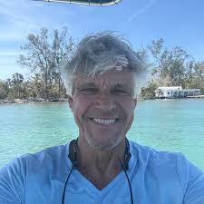 Manatees drinking fresh water from a leaky hose
