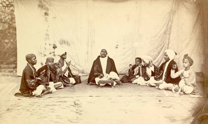 1870 pic of a Pandit reading the Shastras