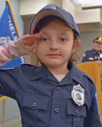 A special uniform for a special kid! We were honored to work in  collaboration with the Chelmsford Police Department and Kids with Cancer to  provide 6 year old Quinn with her own