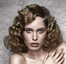 For those who are in love with their long curly hair, the long blonde hair with voluminous loose curls is the best style for them. Women 50s With Big Curls And Long Side Png