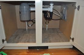Under Cabinet Waterproofing With Peel And Stick Tiles In 2020 Stick On Tiles Peel And Stick Tile Under Kitchen Sinks