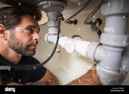 Pipe work under sink hi-res stock photography and images