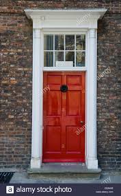 White front door in a red brick building. Pin On Doors