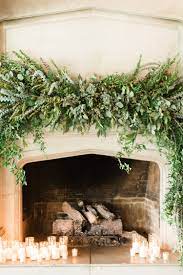 Fireplace Mantel Greenery Including Italian Ruscus Mrytle Passion Vine Baby Blue Eucalyptus See Fireplace Mantels Mantel Floral Arrangements Xmas Fireplace
