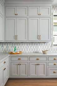 This subtle, light gray paint color is a great choice for kitchen cabinets, kitchen walls, bedroom walls, living rooms and entrance/foyers! Beautiful English Country House In Charlotte With A Modern Twist Country House Design Kitchen Cabinet Colors Moore Kitchen