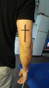 Grey cross bracelet tattoo on ankle. 150 Best Cross Tattoos For Men 2020