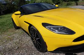 Image result for Sunburst Yellow 2017 Aston Martin
