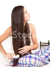Start from about halfway down your hair, and slowly brush the knots and tangles out. Woman Brush Her Long Hair Stock Photos Freeimages Com