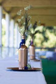 Upcycled Wine Bottles Turned Copper And Royal Blue Table Centerpieces Photo By Nallayers Wine Wedding Decor Blue Wedding Centerpieces Blue Wedding Decorations
