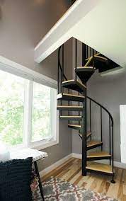 The Vacationer Minimalist Spiral Stairs Paragon Stairs Home Stairs Design Spiral Stairs Design Loft Staircase