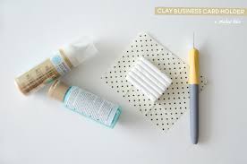 Fold the leather into an envelope shape and use a small hole punch to punch a hole in two corners and the center: Diy Business Card Holder The Folding Chair