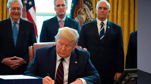 Trump signs stimulus package into law. Trump Signs 2 Trillion Virus Bill Largest Ever U S Stimulus Bloomberg