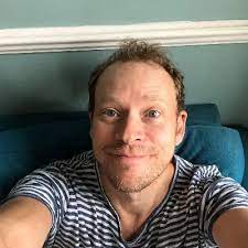 Described in the novel as a burly man fifty years of age, with deep blue eyes and a steel gray mustache, he is a former professional hunter who worked with hammond at one of his previous parks in kenya. J5avajilla8 Vm