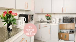 The actual cabinet frames were yellowish from cooking and natural wear and tear but the actual doors were still crisp white because of their finish. How To Paint Laminate Mdf Kitchen Cupboards Work Space Makeover Youtube