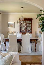 Traditional Dining Room Beautiful Slipcovered Dining Chairs Brings Softness To The Formal D Dining Room Paint Colors Dining Room Contemporary Dining Room Paint