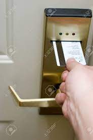 Once it's fully inserted, hold the key as close to the lock as you can and turn it. Photo Of Person S Hand Inserting A Key Card Into An Electronic Hotel Door Security Lock To Unlock The Door Stock Photo Picture And Royalty Free Image Image 77773575
