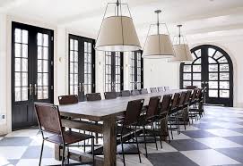 This room has a french door and windows which make the outdoors more visible, thus, giving a fresh feeling to the room. Black French Doors Line Spacious Dining Room Pella