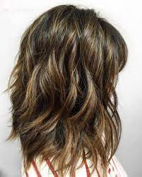 Undoubtedly, this wavy longer bob is so pretty with the contrasting brown and blonde lowlights. 80 Sensational Medium Length Haircuts For Thick Hair In 2021