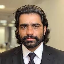 Imran Khan, captain of Pakistan holds the ICC Cricket World Cup 1992 trophy  aloft after beating England in the final at Melbourne