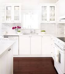 white kitchen countertops and cabinets
