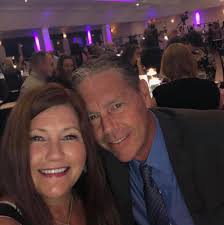 How do you cut the excess paper off when decoupaging a round table top?