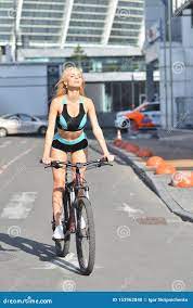 Girl with Big Tits Rides Bicycle, Urban Background Stock Photo - Image of  healthy, cycle: 153962840