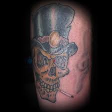 However, the skull has long been regarded by most cultures as a symbol of death. Traditional Smoking Skull Tattoo With Top Hat