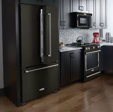 With intricate mosaic tiles making up the focal point of this kitchen, metal finishes play an important supporting role. 45 The Black Stainless Steel Kitchen Appliances Cabinet Colors Game Decorinspira Com