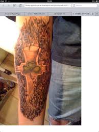 In the third session, a custom piece was added to the inside of the arm, above the band, to fill the remaining space around the letter, and a. Celtic Cross Four Leaf Clover Flames Half Sleeve Tattoo Com