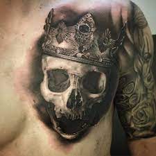 He would give a lion a run for its money to be king of the jungle. A Skull Topped With A Regal Crown Via David Rinklin Ig Neonjudas Davidrinklin Blackandgrey Realism Skulls Tattoos For Guys Chest Tattoo Men Chest Tattoo
